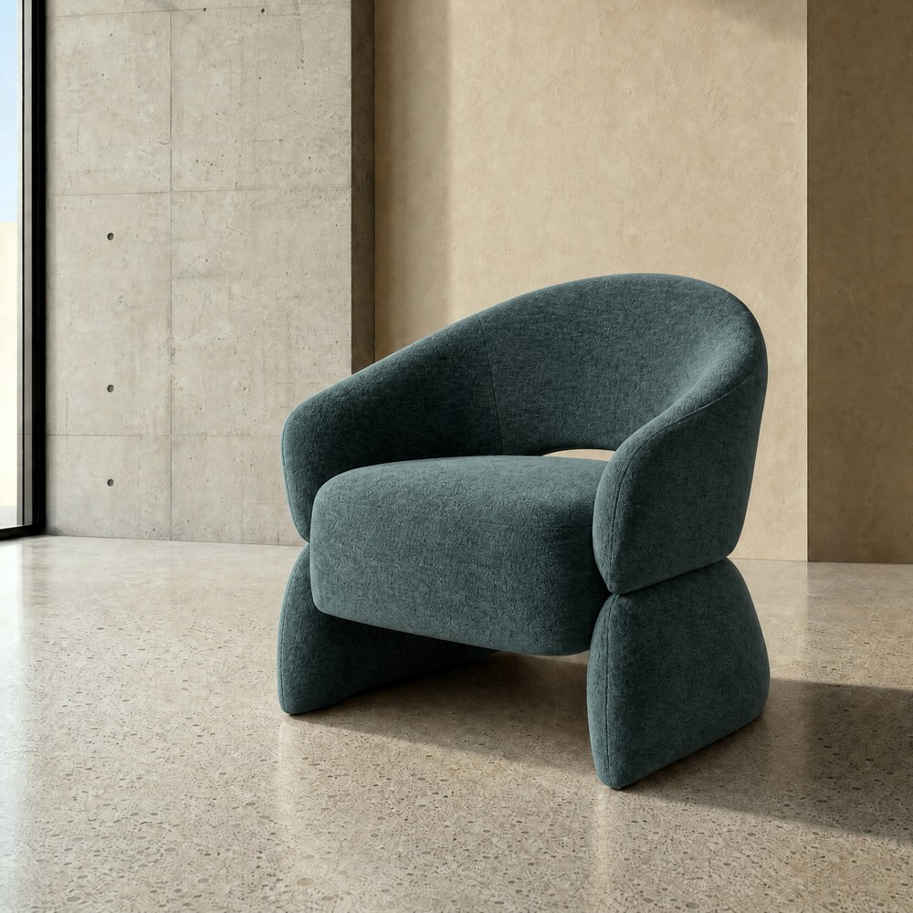 Sillón bajo envolvente con brazos en tejido verde azulado 77 x 73,5 x 75 cm